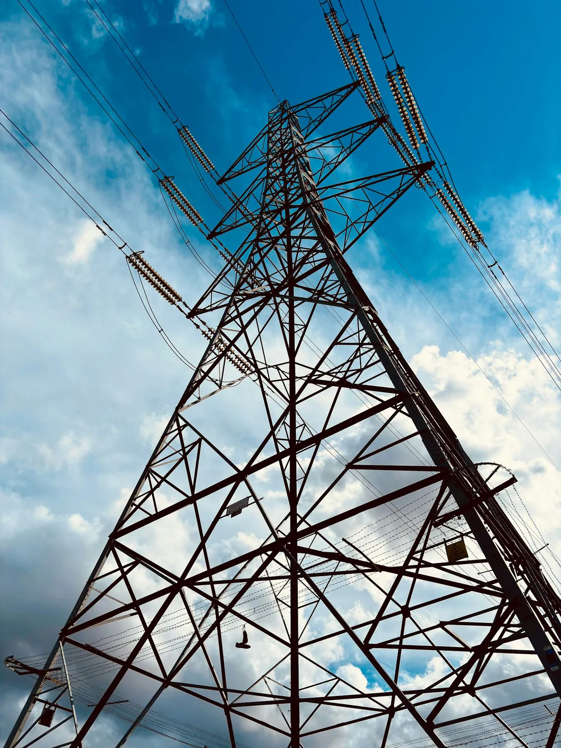 Lattice transmission tower structure viewed from below
