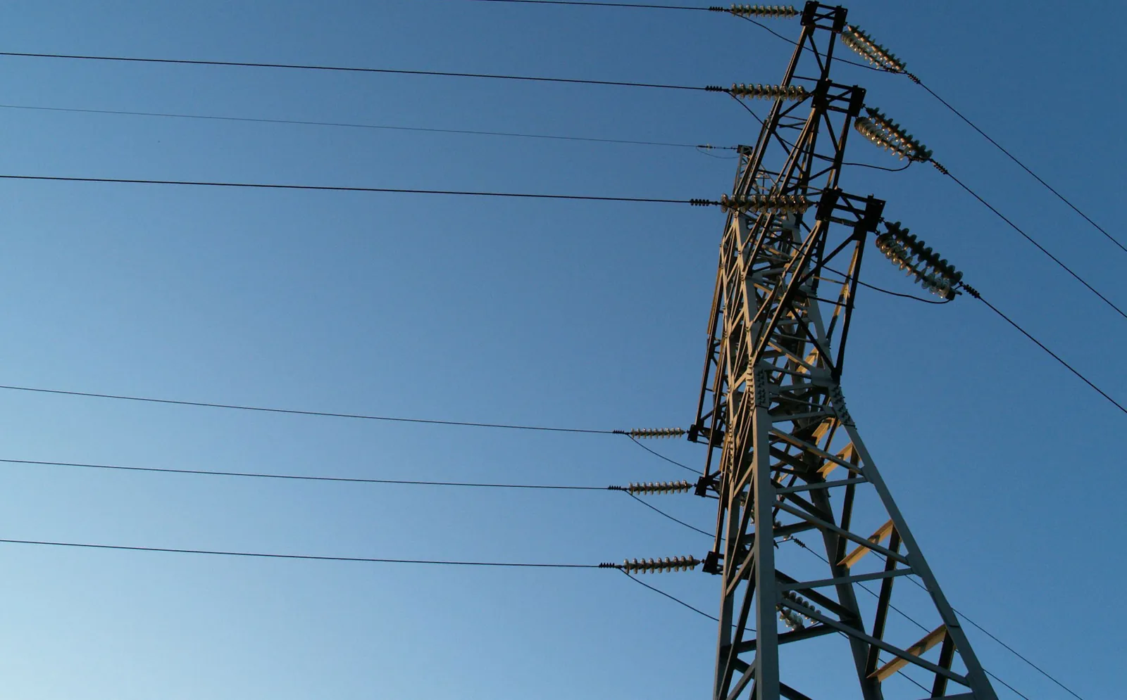 Overhead power transmission lines crossing a landscape